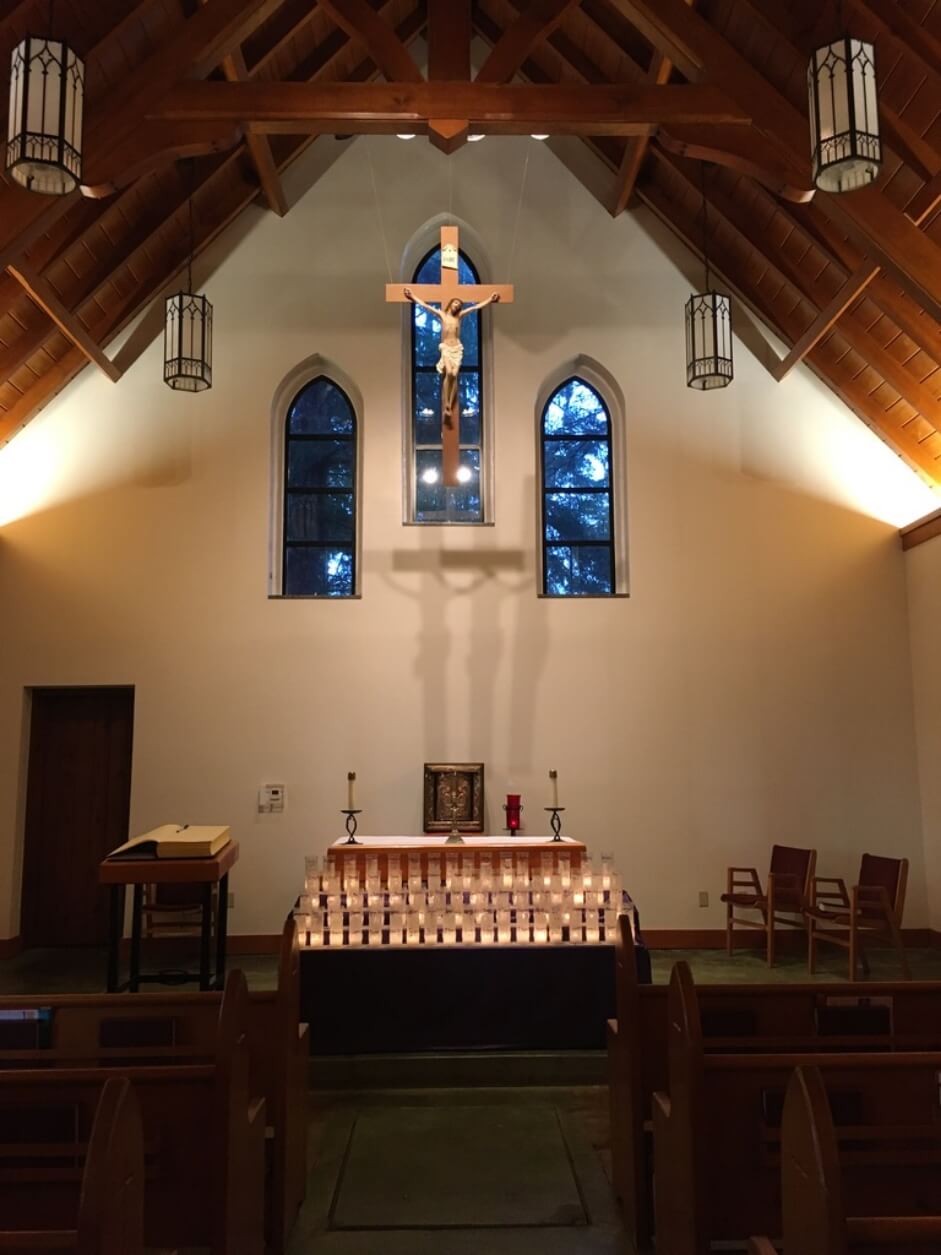 Cross hanging above the alter inside the shrine chapel