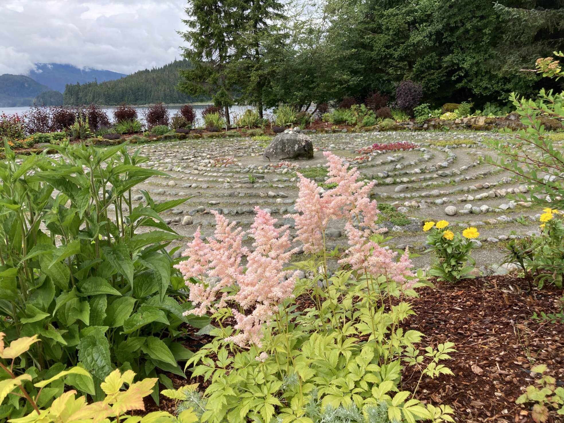 Merciful Love Labyrinth with pink and yellow flowers